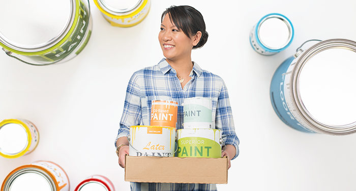 woman with recycled paint cans
